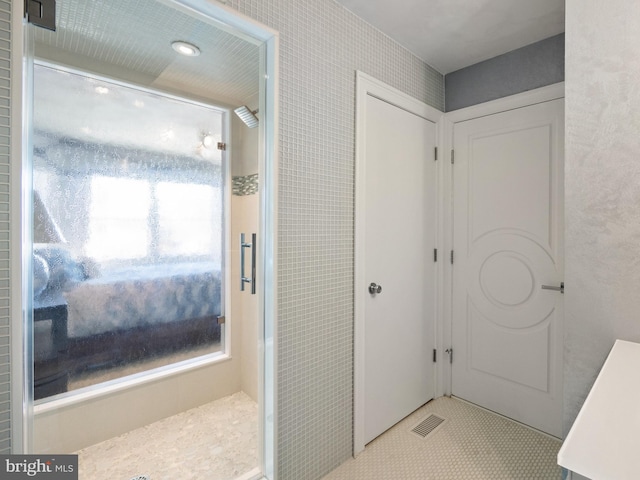 bathroom featuring visible vents and walk in shower