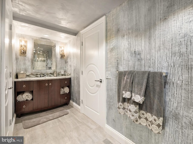 bathroom featuring vanity and baseboards