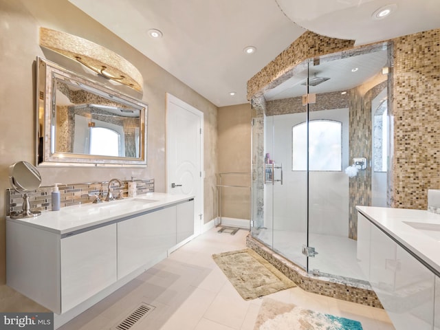 bathroom with a stall shower, visible vents, decorative backsplash, vanity, and recessed lighting