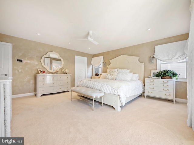 bedroom featuring recessed lighting, light colored carpet, ceiling fan, and baseboards