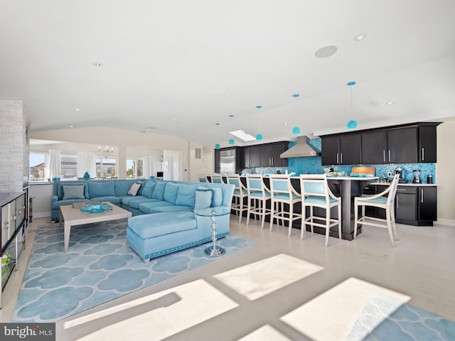 living room featuring lofted ceiling and recessed lighting