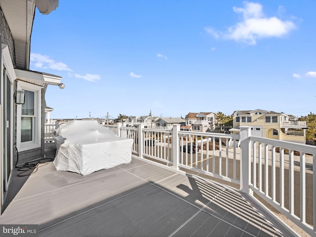 wooden deck featuring a residential view