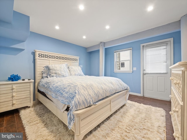 bedroom with recessed lighting, baseboards, and wood finished floors