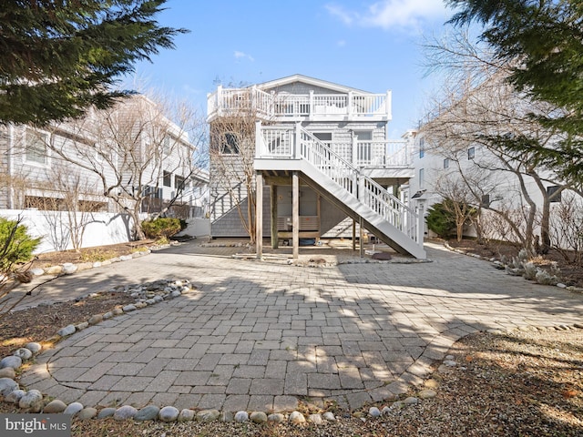 back of house with stairway