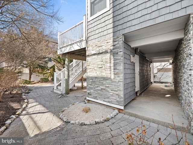 view of home's exterior featuring stairway