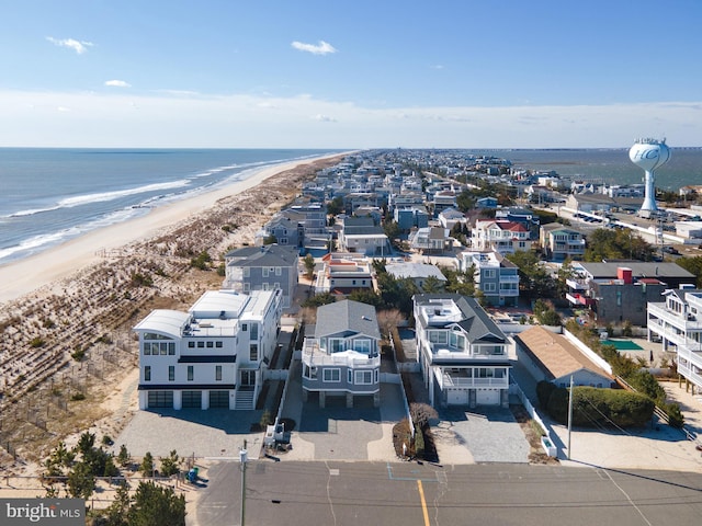 bird's eye view with a view of the beach and a water view