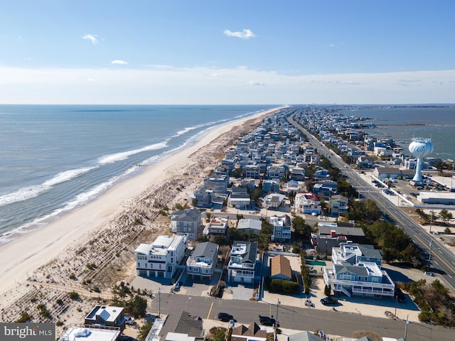 drone / aerial view with a view of the beach and a water view