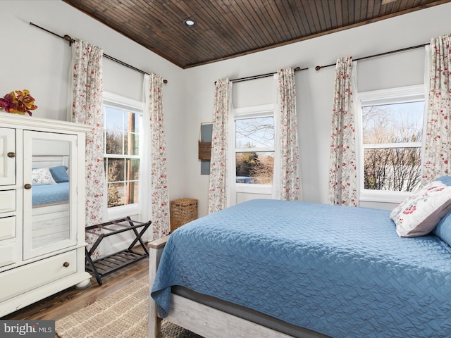 bedroom featuring wooden ceiling and wood finished floors