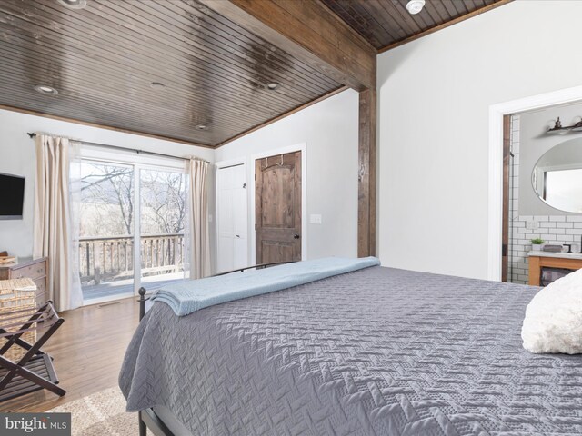 bedroom with access to outside, wood finished floors, wood ceiling, and crown molding