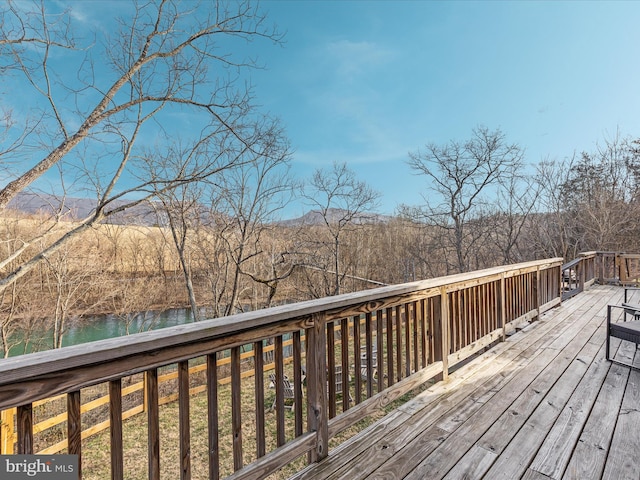 wooden terrace with a water view