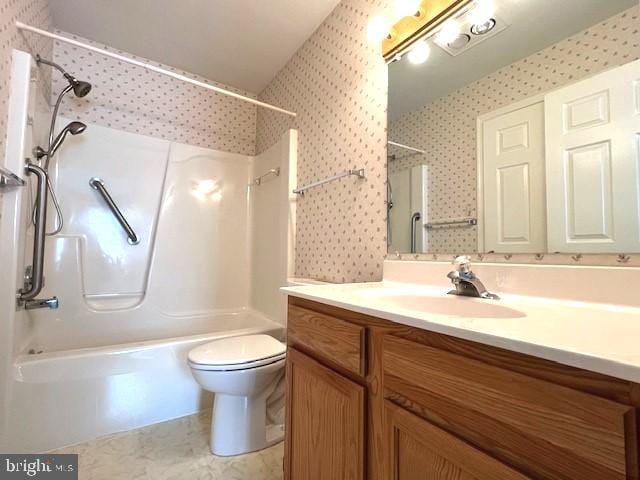 bathroom with toilet, wallpapered walls, washtub / shower combination, and vanity