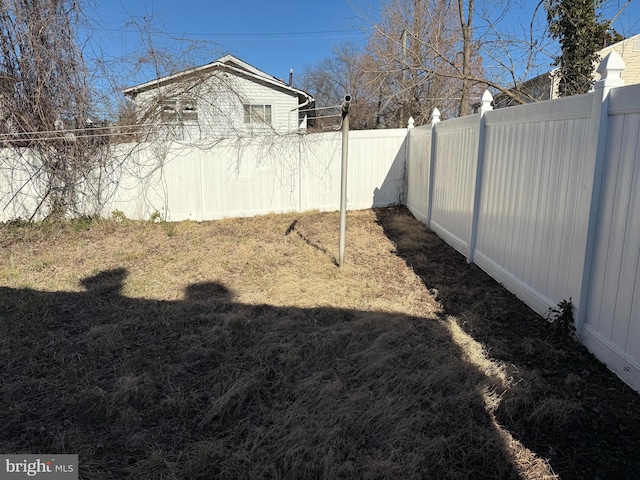 view of yard with a fenced backyard