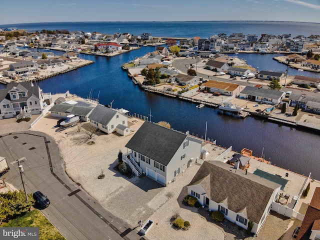 aerial view with a water view and a residential view