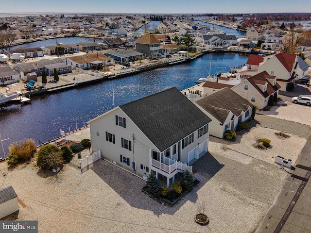 aerial view with a water view and a residential view