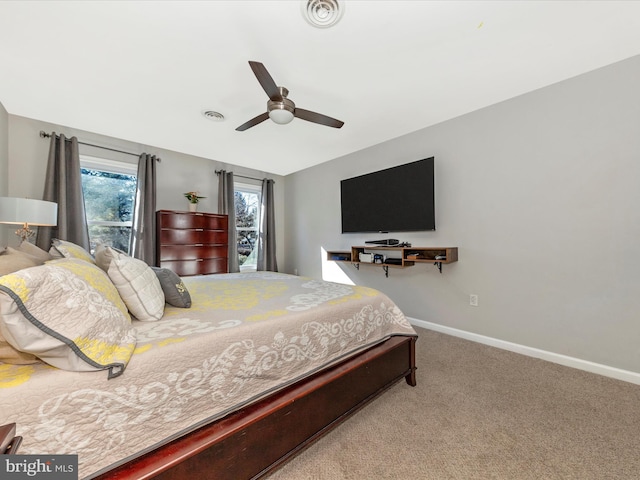 bedroom featuring visible vents, baseboards, carpet, and ceiling fan