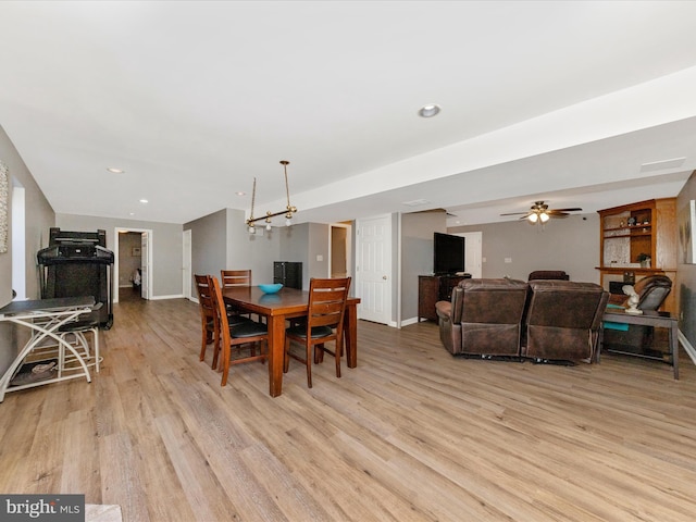 dining space featuring recessed lighting, light wood-type flooring, and baseboards