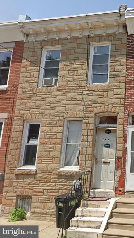 view of front of home with stone siding