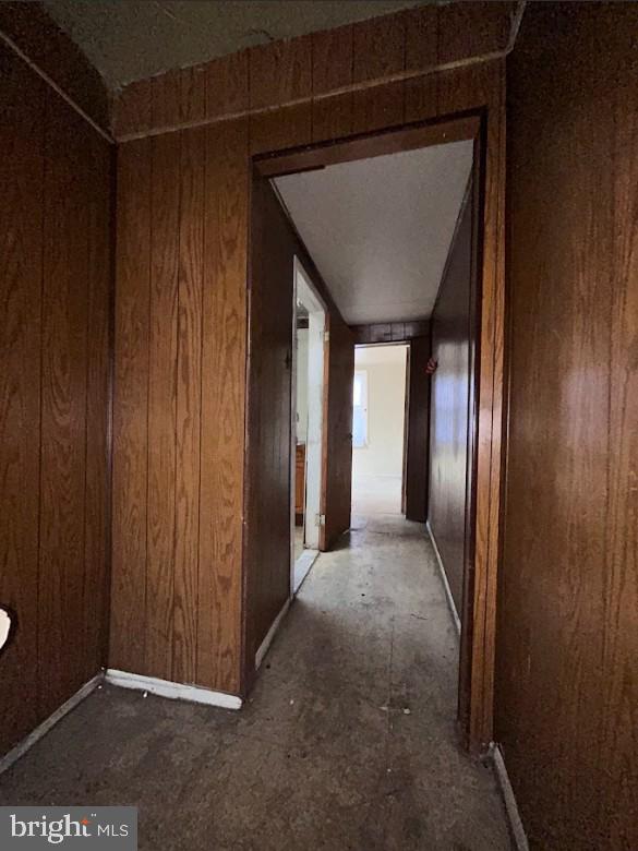 hallway with wooden walls