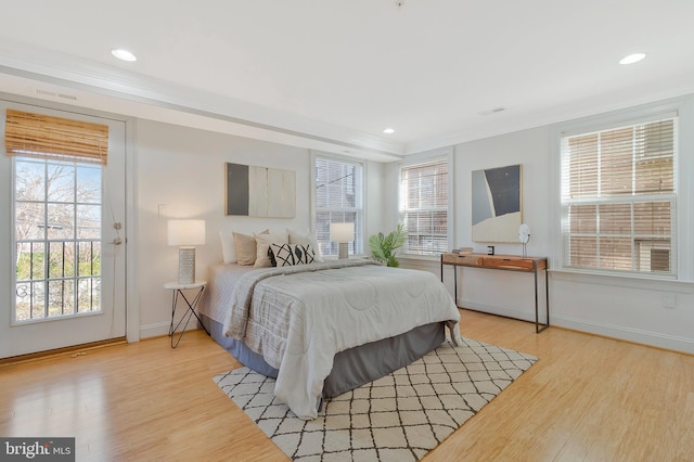 bedroom featuring light wood-style flooring, baseboards, and recessed lighting