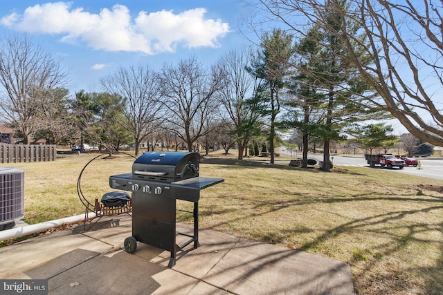 exterior space featuring cooling unit and fence