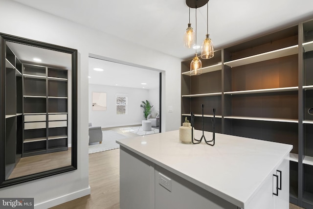 office area featuring recessed lighting, baseboards, and wood finished floors