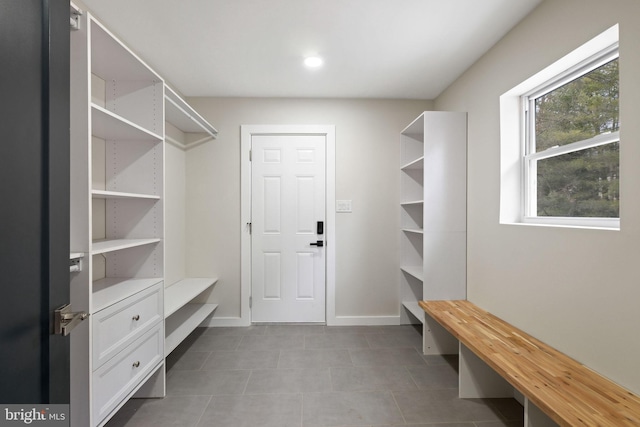 mudroom featuring baseboards and tile patterned floors