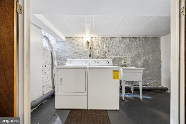 washroom featuring laundry area and separate washer and dryer