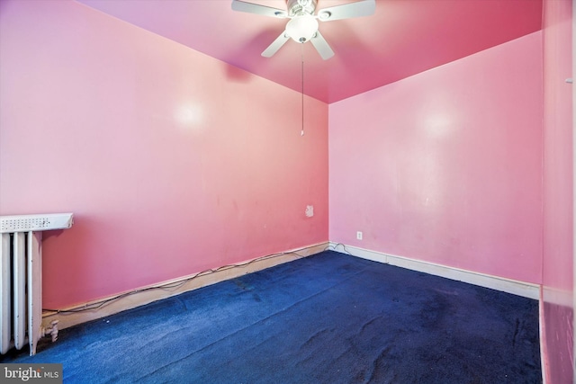 carpeted empty room with a ceiling fan