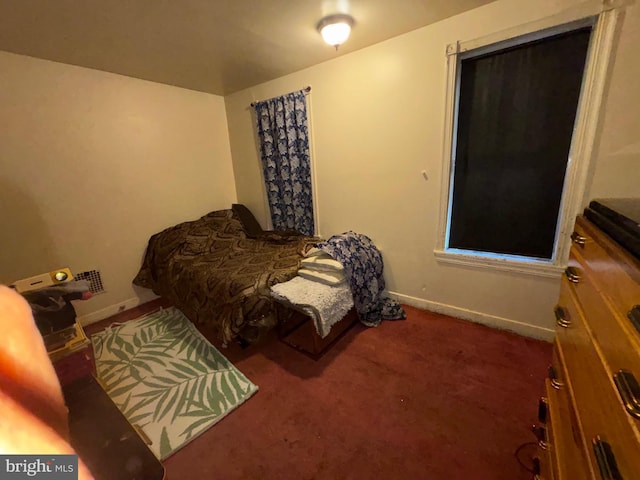 carpeted bedroom with baseboards