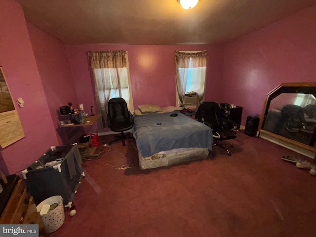 bedroom featuring carpet floors and multiple windows