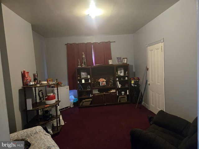 interior space featuring dark colored carpet