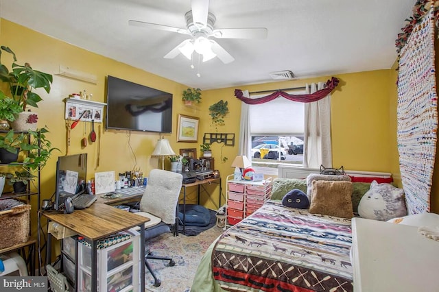 bedroom featuring a ceiling fan and visible vents