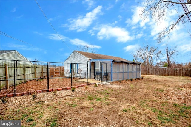 back of house with a fenced backyard