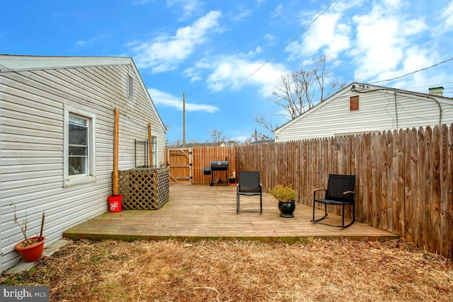 view of yard with fence and a wooden deck