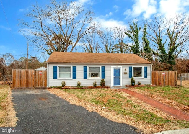 view of front of house with a gate and fence