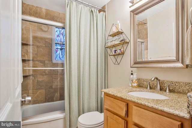 bathroom with shower / bath combo, vanity, and toilet