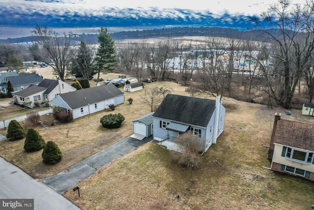 birds eye view of property with a residential view