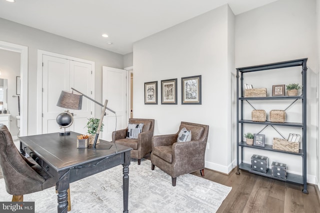 office featuring recessed lighting, baseboards, and wood finished floors