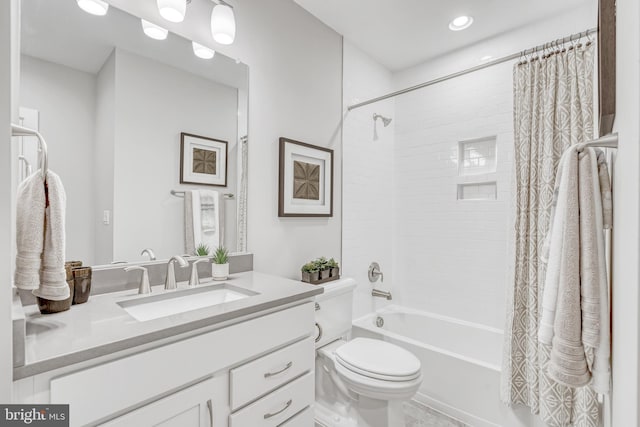 full bath featuring vanity, shower / bath combination with curtain, and toilet