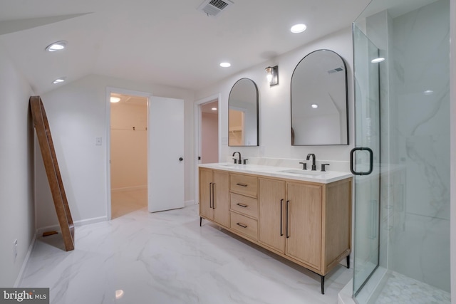 bathroom featuring marble finish floor, a sink, visible vents, and recessed lighting