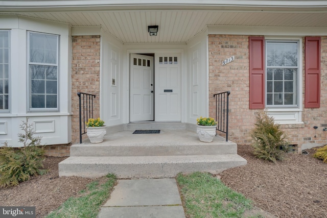 entrance to property with brick siding