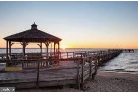 dock area with a water view and a gazebo