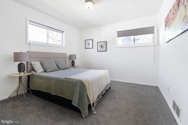 bedroom featuring carpet floors, visible vents, and baseboards