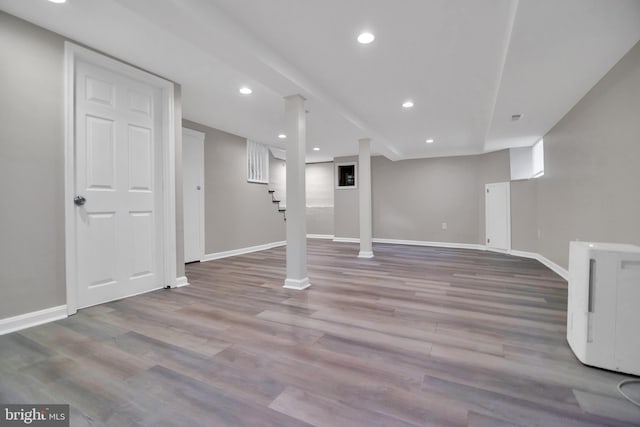 finished below grade area with recessed lighting, wood finished floors, and baseboards