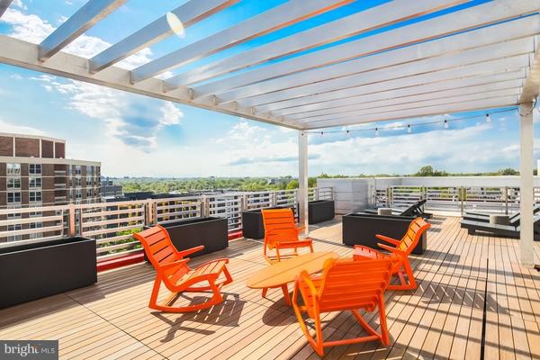 wooden deck featuring an outdoor living space and a pergola