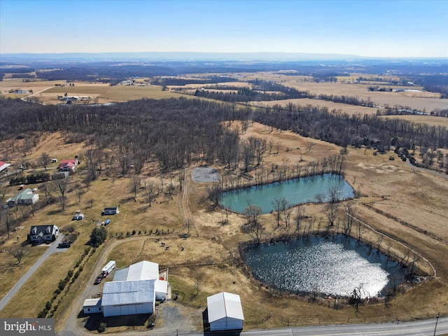 birds eye view of property with a rural view