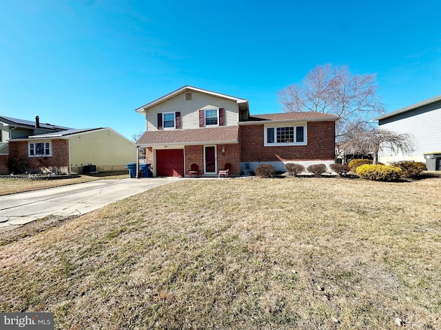 split level home featuring brick siding, a garage, cooling unit, driveway, and a front lawn