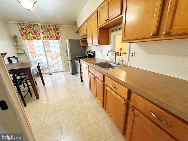 kitchen featuring brown cabinetry, stainless steel appliances, crown molding, under cabinet range hood, and a sink