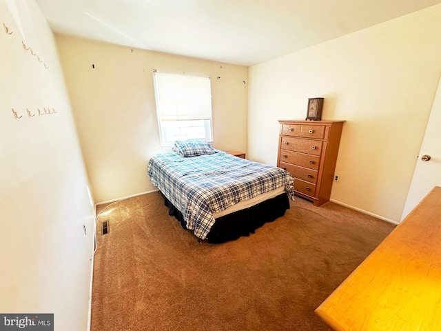 carpeted bedroom with baseboards