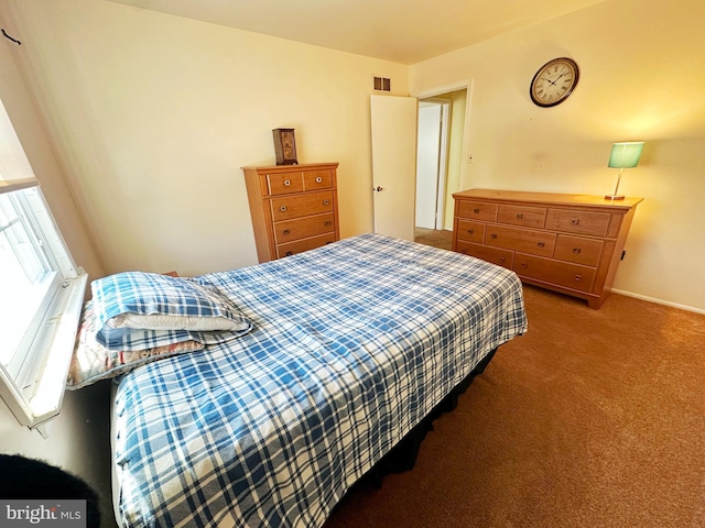 carpeted bedroom with visible vents